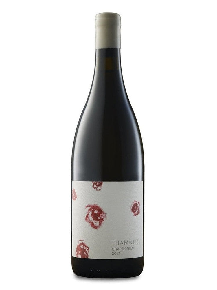Thamnus Chardonnay wine bottle with textured white label and abstract red swirls